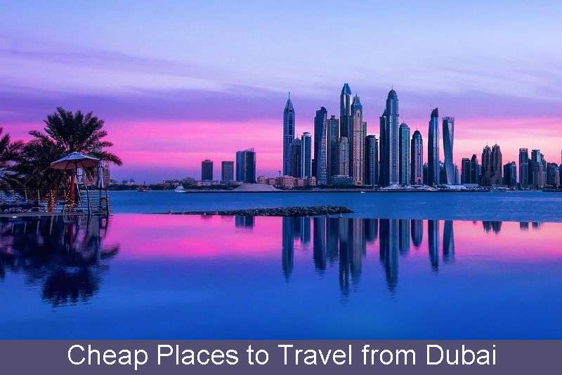 Dubai's iconic skyline reflects in water, showcasing modern elegance.
