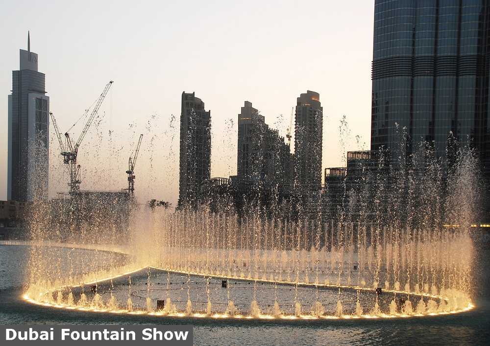 The image illustrates a captivating fountain dance, offering an ideal setting for a cost-free family outing.