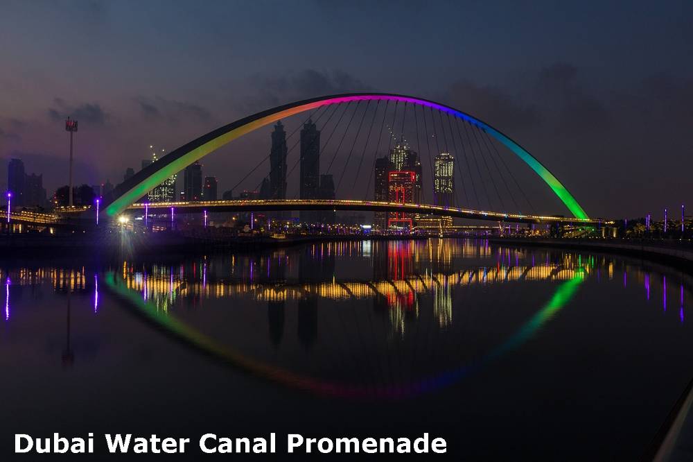 A night view of Dubai Water Canal Promenade best place in Dubai for families to visit.